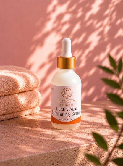 Lumocea Lactic Acid Exfoliating Serum bottle on a pink surface with a towel and plant